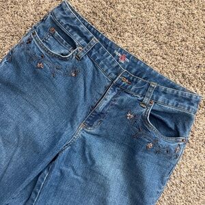 Blue bootcut jeans with floral embroidery